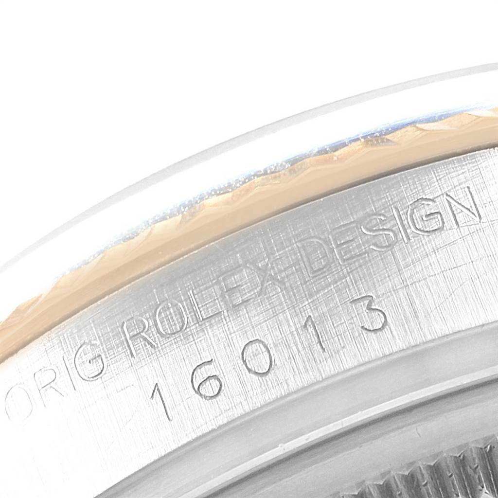 The image shows a close-up angle of the side of a Rolex Vintage Collection 16013 Men's Stainless Steel Black Dial 16013 Men's Stainless Steel Black Dial watch case, displaying the brand engraving and model number 16013.