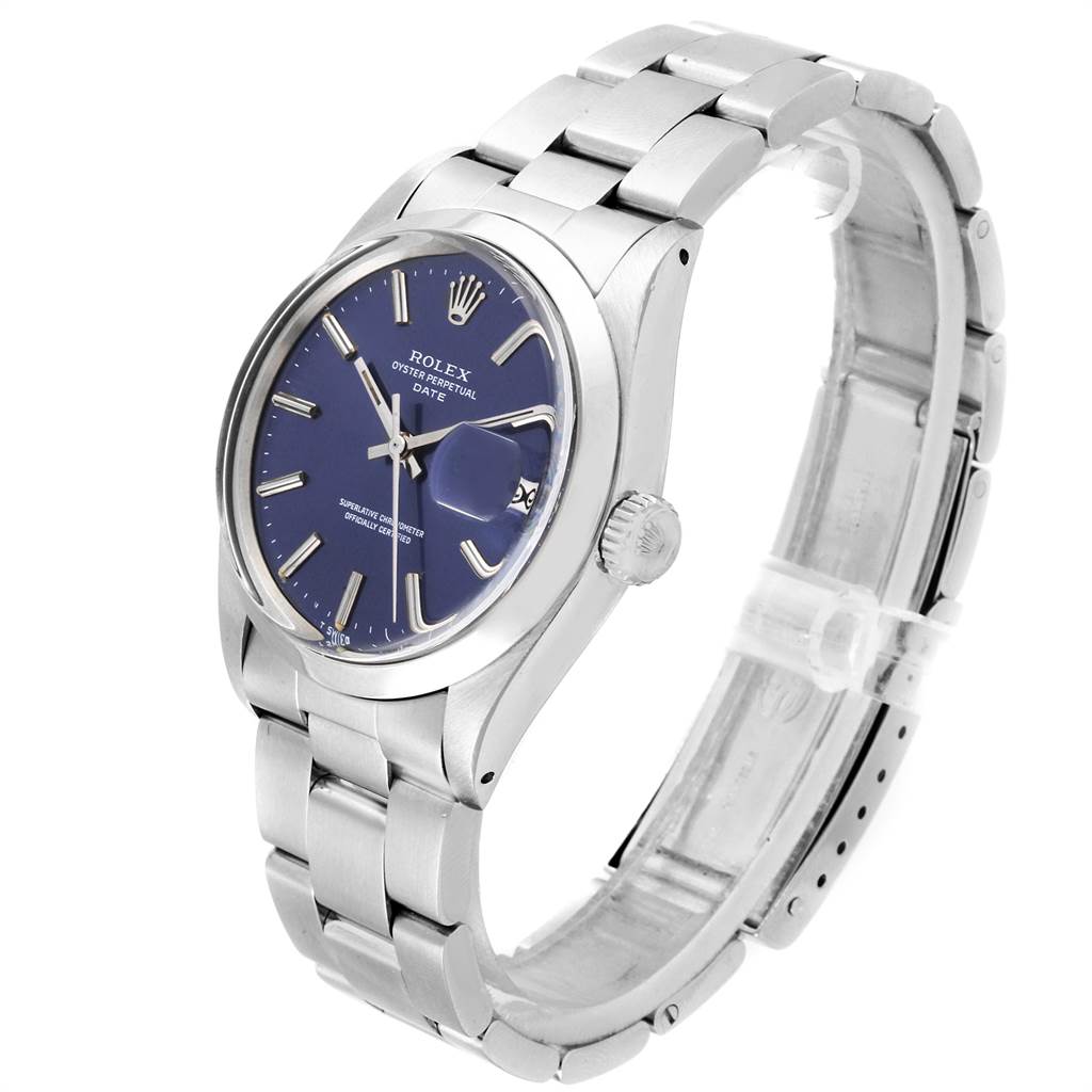 The image shows a side angle of the Rolex Vintage Collection 1500 Men's Stainless Steel Blue Dial 1500 Men's Stainless Steel Blue Dial watch, highlighting the blue dial, bezel, and stainless steel bracelet.