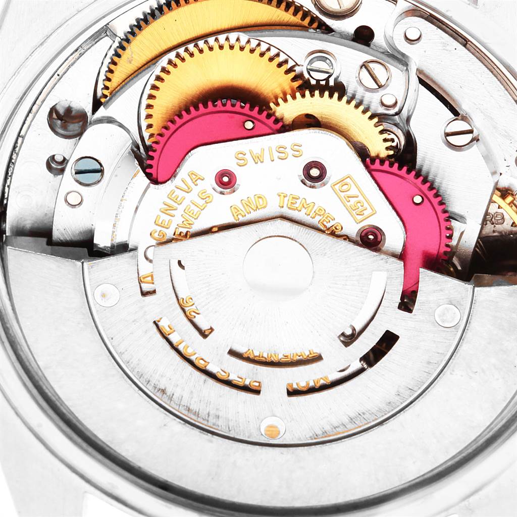 This image shows a close-up of the intricate internal mechanisms of a Rolex Vintage Collection 1500 Men's Stainless Steel Blue Dial 1500 Men's Stainless Steel Blue Dial watch.