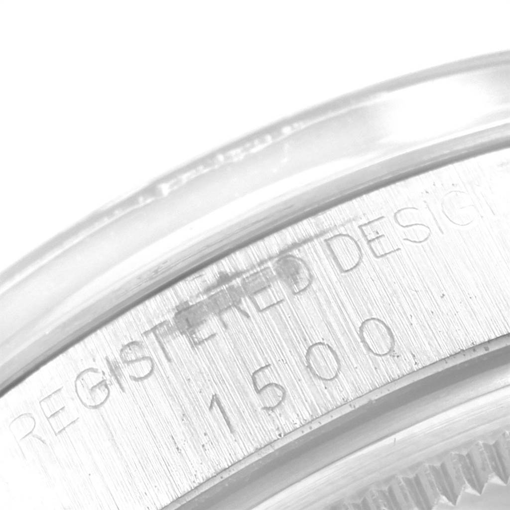 This close-up image shows the engraved case back of a Vintage Collection model by Rolex, detailing the design registration and model number.
