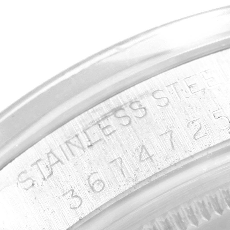 This image shows a close-up angle of the case back and engraved serial number on the Vintage Collection model by Rolex.