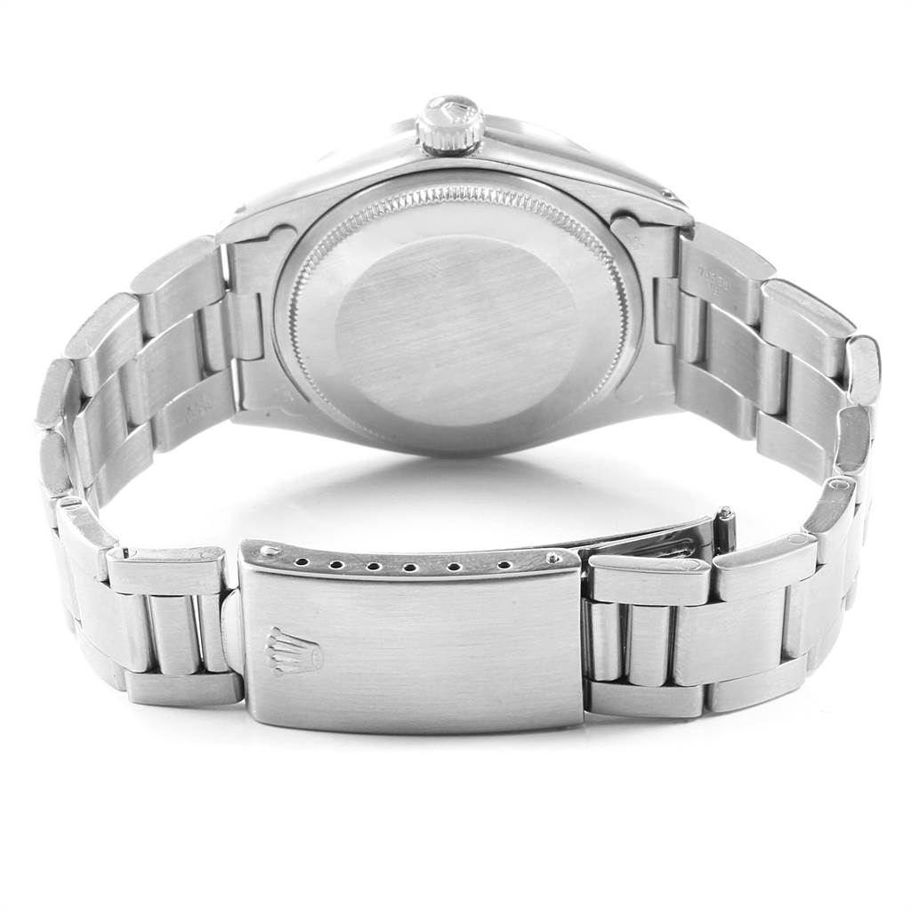 The image shows the back case and bracelet clasp of a Rolex Vintage Collection 1501 Men's Stainless Steel Silver Dial 1501 Men's Stainless Steel Silver Dial watch.