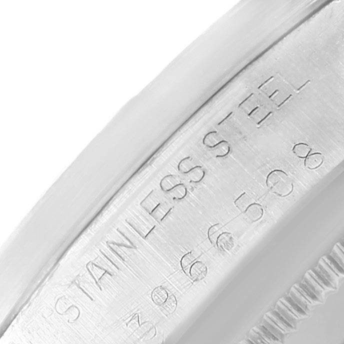 This close-up image shows the side engraving on the stainless steel case of a Rolex Vintage Collection 1501 Men's Stainless Steel Silver Dial 1501 Men's Stainless Steel Silver Dial watch.