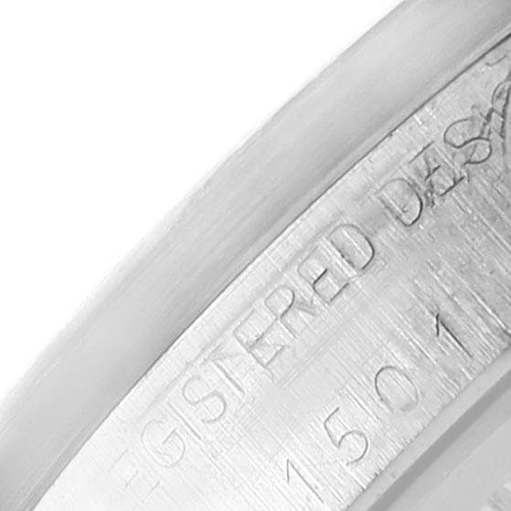 This close-up image of the Rolex Vintage Collection 1501 Men's Stainless Steel Silver Dial 1501 Men's Stainless Steel Silver Dial model shows the engraved lettering on the watch's bezel.