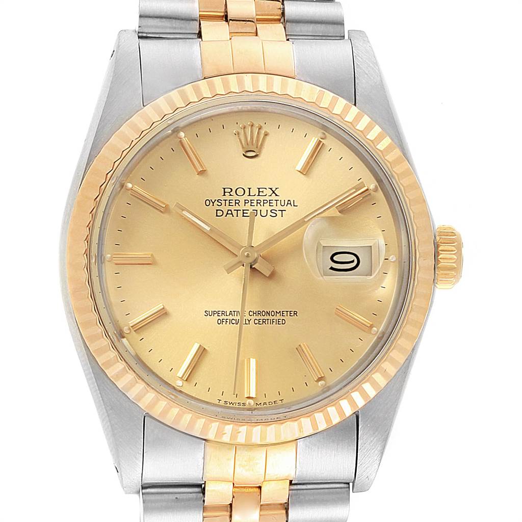 This is a front view of the Rolex Vintage Collection 16013 Men's Stainless Steel Champagne Dial 16013 Men's Stainless Steel Champagne Dial Datejust watch showing the dial and part of the two-tone bracelet.