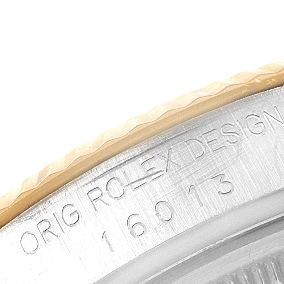 The image shows an angled close-up of the serial and model number engraving detail on the bezel of the Vintage Collection Rolex watch.