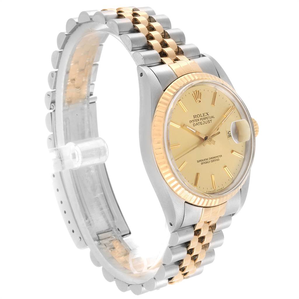 The Vintage Collection Rolex watch is shown at a side angle, highlighting its two-tone bracelet, gold dial, and fluted bezel.