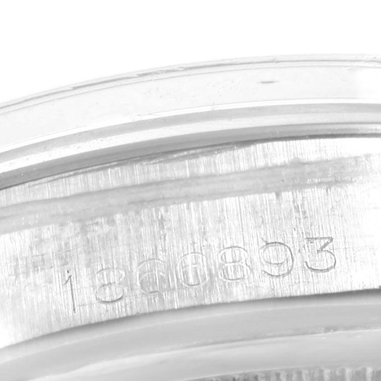 This image shows a close-up angle of the serial number engraved on the case of a Vintage Collection model by Rolex.