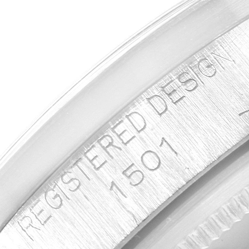 This close-up image shows the engraved bezel of a Rolex Vintage Collection 1501 Men's Stainless Steel Silver Dial 1501 Men's Stainless Steel Silver Dial watch, displaying the "REGISTERED DESIGN 1501" text.