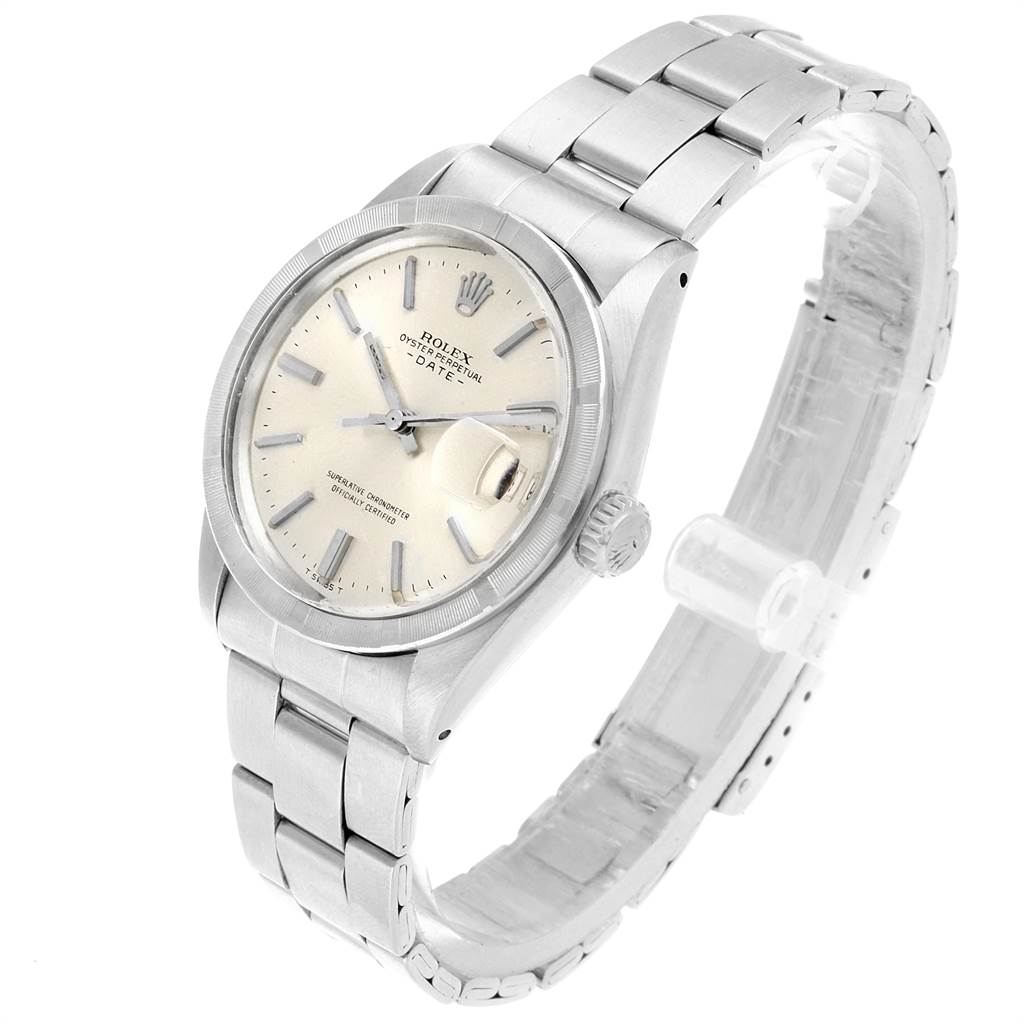 The Vintage Collection Rolex watch is shown at a slight angle, displaying its face, bezel, crown, and metal bracelet.