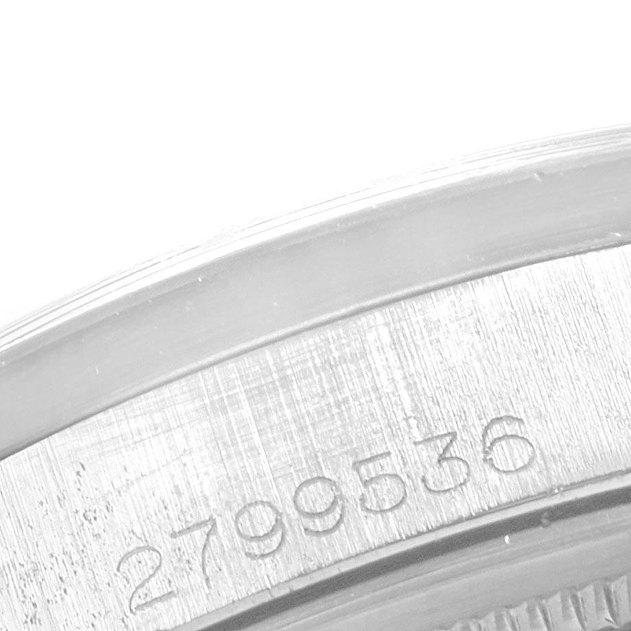 The image shows a close-up of the serial number on the case of a Rolex Vintage Collection 1501 Men's Stainless Steel Silver Dial 1501 Men's Stainless Steel Silver Dial watch.