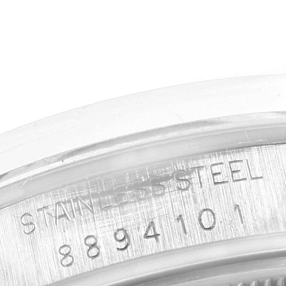 This close-up image shows the engraved stainless steel casing with serial numbers on the Vintage Collection model by Rolex.