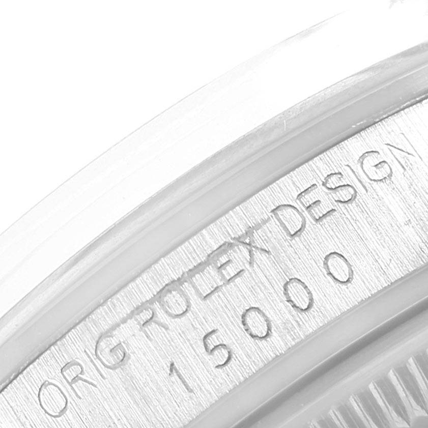 This close-up image shows the engraved case back of the Vintage Collection Rolex watch with model number 15000.
