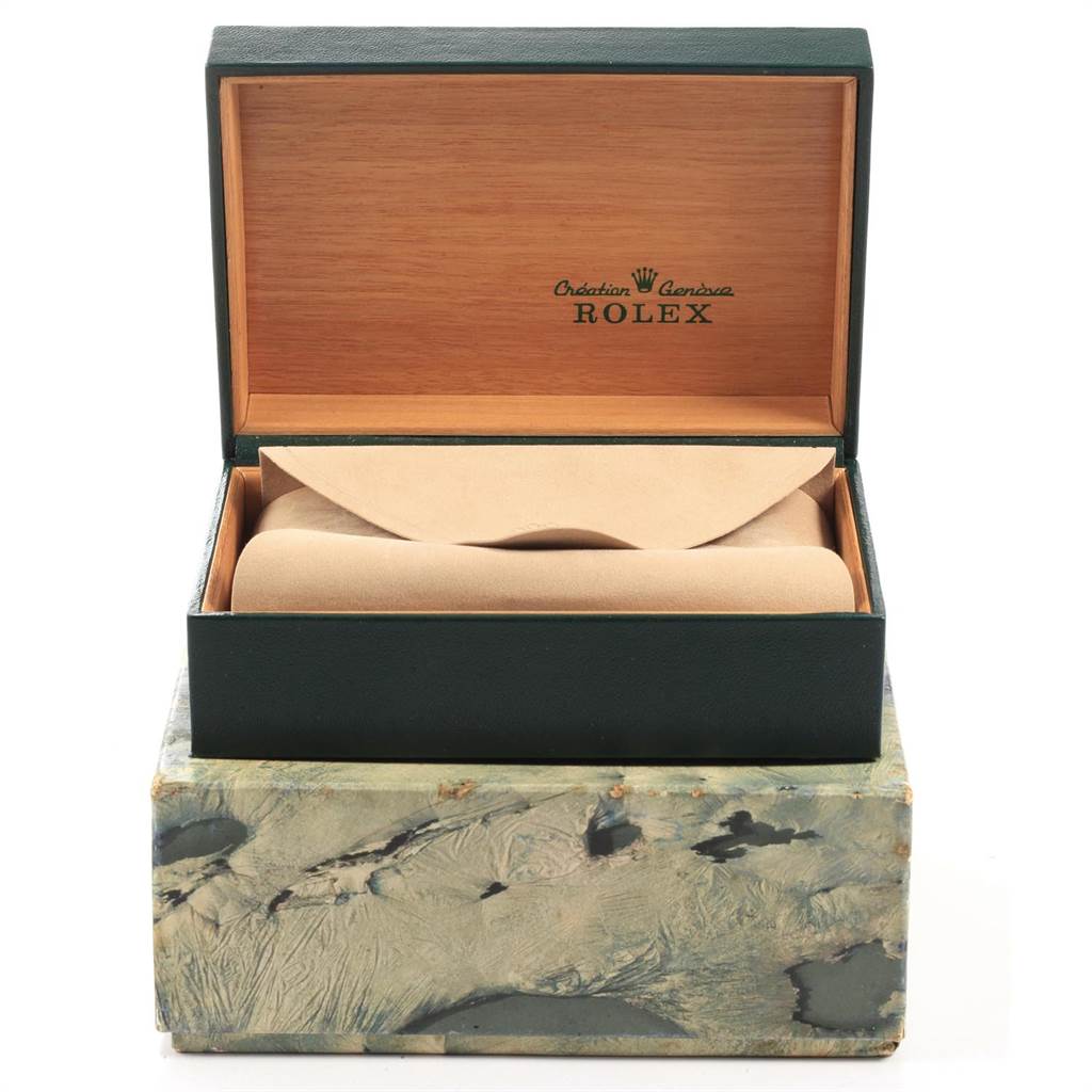 The image shows an open green box containing an empty tan pillow for the Rolex Vintage Collection 1601 Men's Stainless Steel Silver Dial 1601 Men's Stainless Steel Silver Dial watch, viewed from the front.