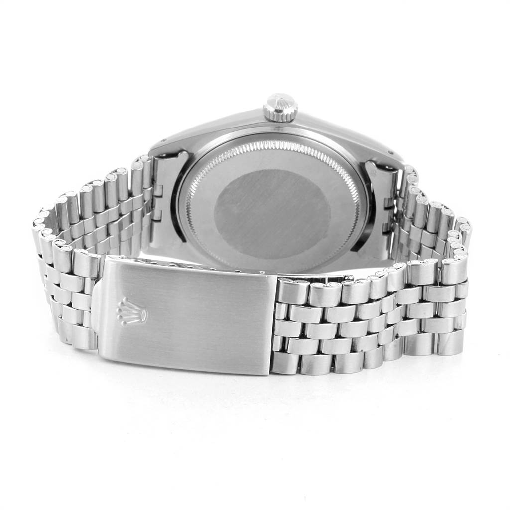 The image shows the back case and bracelet of a Rolex Vintage Collection 1601 Men's Stainless Steel Silver Dial 1601 Men's Stainless Steel Silver Dial model watch, focusing on the clasp and crown.