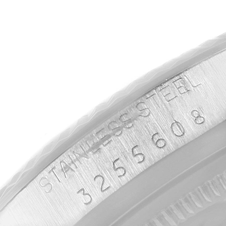 This image shows a close-up of the serial number engraving on the stainless steel case of the Rolex Vintage Collection 1601 Men's Stainless Steel Silver Dial 1601 Men's Stainless Steel Silver Dial model.