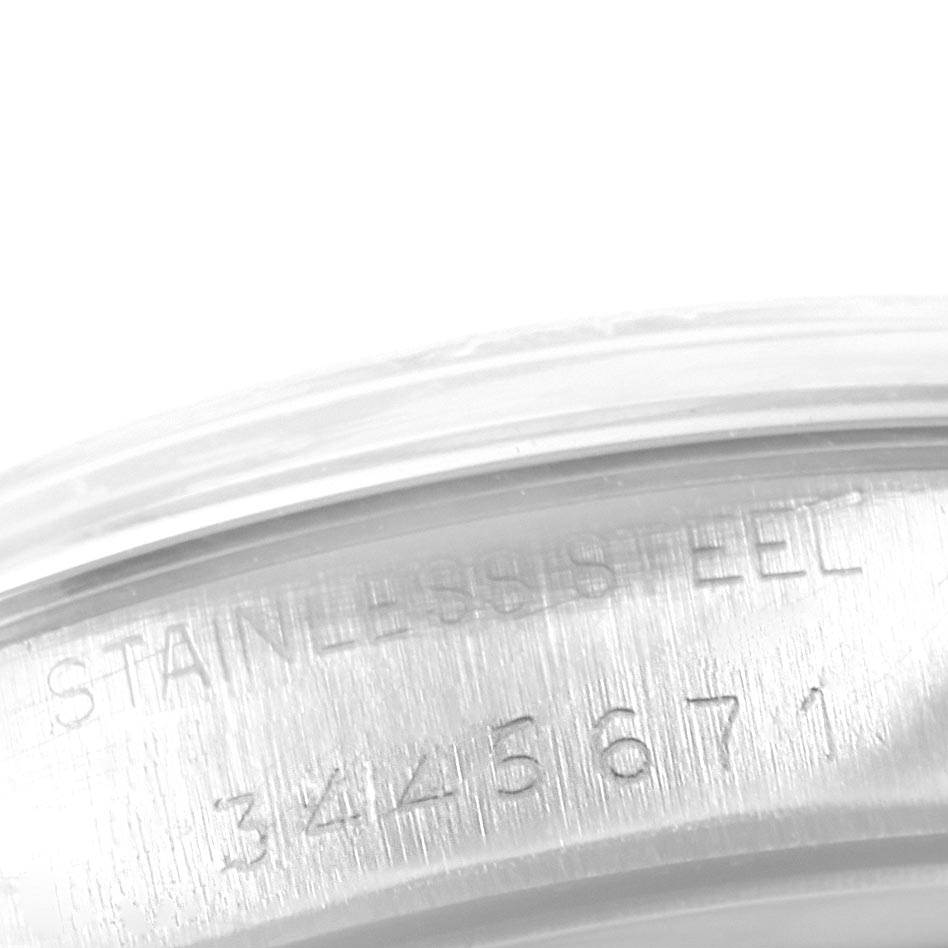 The image shows a close-up of the engraving on the stainless steel case back of a Rolex Vintage Collection 6694 Men's Stainless Steel Silver Dial 6694 Men's Stainless Steel Silver Dial model watch.