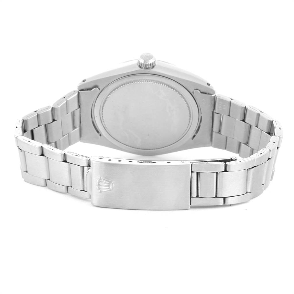 The image shows the back case and bracelet clasp of the Rolex Vintage Collection 6694 Men's Stainless Steel Silver Dial 6694 Men's Stainless Steel Silver Dial watch.