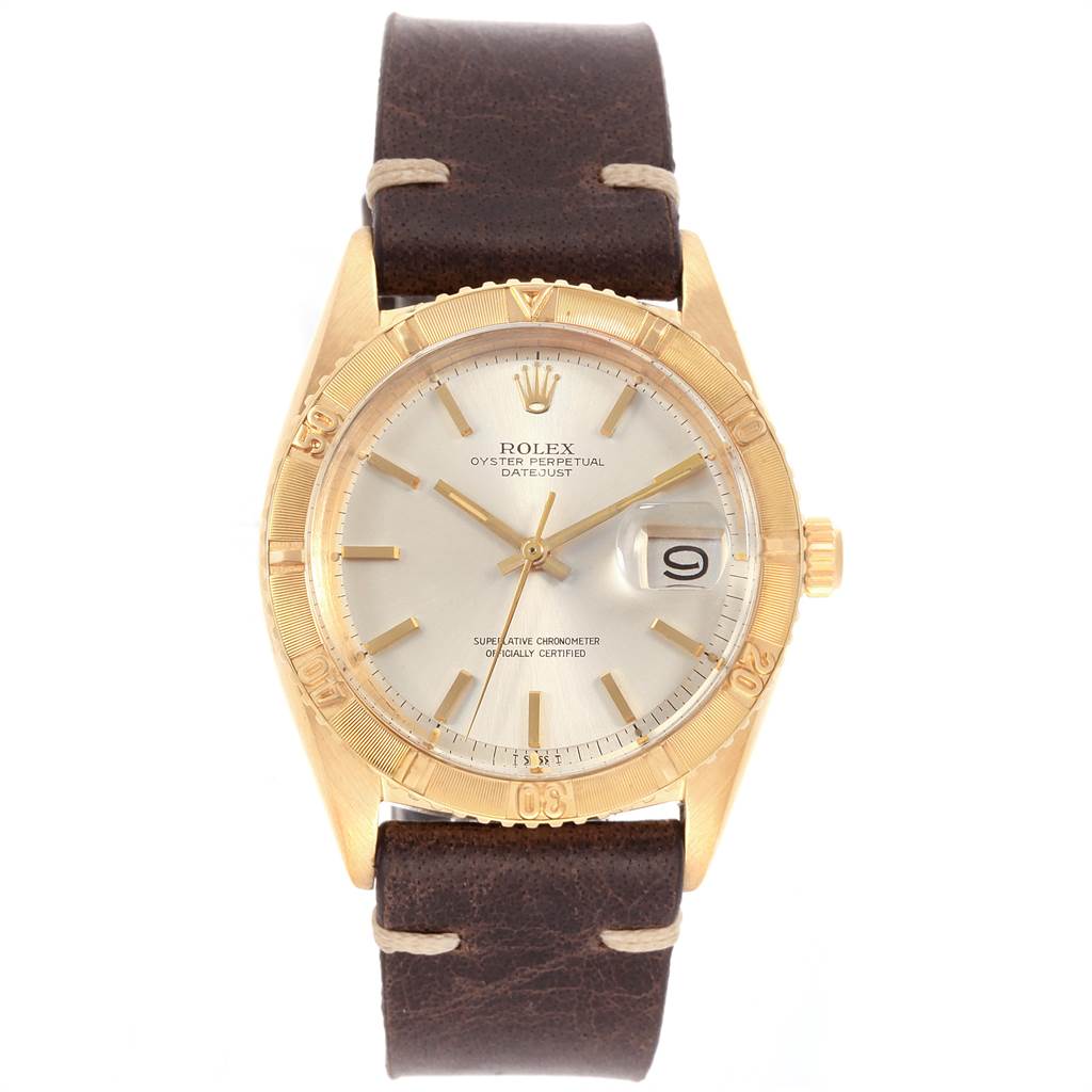 The Rolex Vintage Collection 1625 Men
s Yellow Gold Silver Dial 1625 Men
s Yellow Gold Silver Dial watch is shown from a front angle, featuring a leather strap, gold bezel, and date display.
