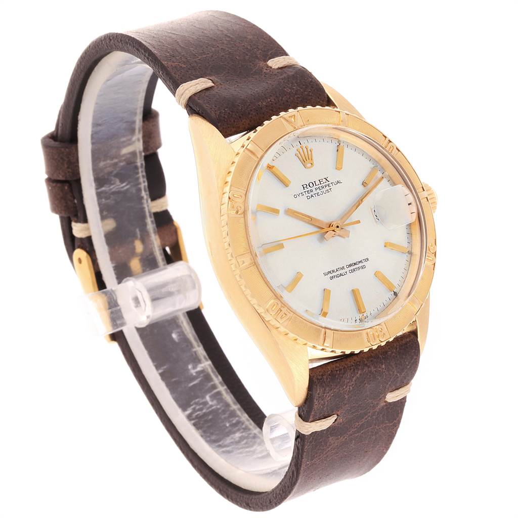 The Rolex Vintage Collection 1625 Men
s Yellow Gold Silver Dial 1625 Men
s Yellow Gold Silver Dial model is shown at an angle highlighting the dial, bezel, and brown leather strap.