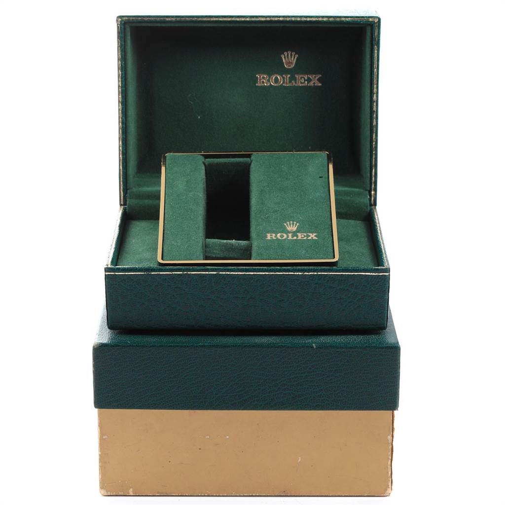 The image shows an open box displaying the packaging for a Vintage Collection model by Rolex, with the compartments for the watch visible.