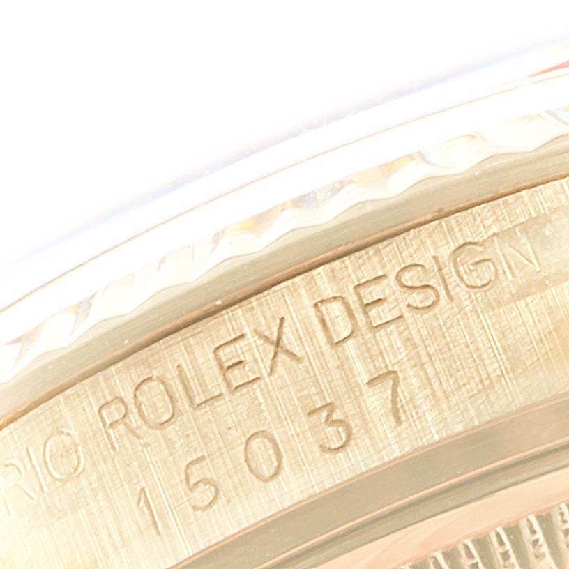 This close-up image shows the engraved details on the side of the Rolex Vintage Collection 15037 Men
s Yellow Gold Blue Dial 15037 Men
s Yellow Gold Blue Dial model
s case.