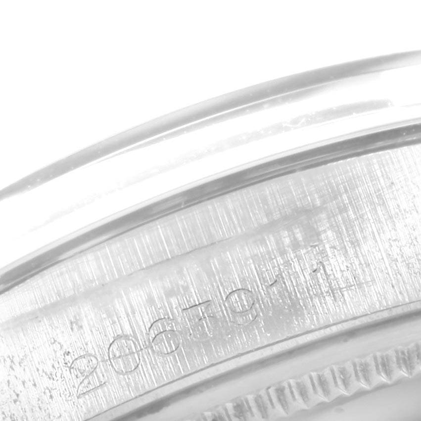 This image shows a close-up of the serial number engraving on the side of the Vintage Collection Rolex watch case.