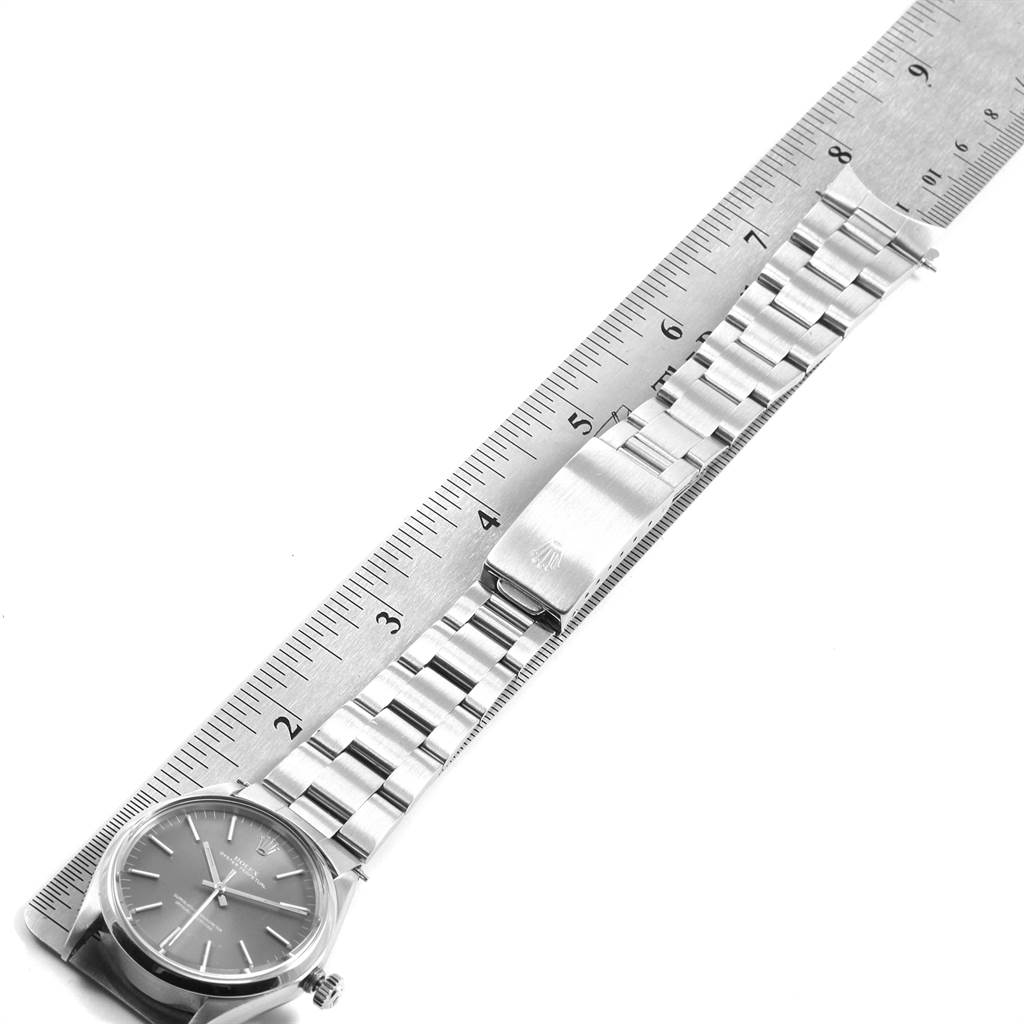 The image shows a Vintage Collection model Rolex watch laid flat next to a ruler, displaying the face and bracelet of the watch.