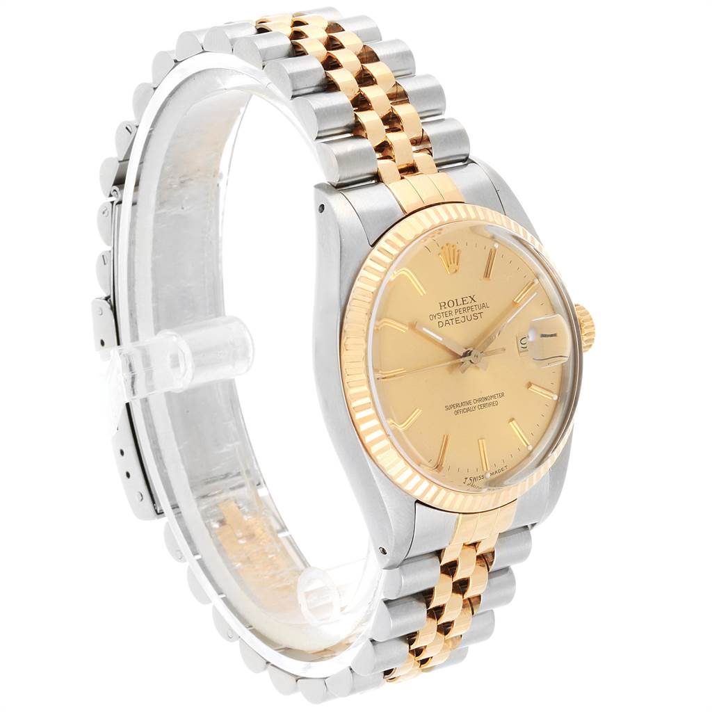 The image shows a side angle of the Rolex Vintage Collection 16013 Men's Stainless Steel Champagne Dial 16013 Men's Stainless Steel Champagne Dial Datejust, featuring its gold dial, bezel, and two-tone bracelet.