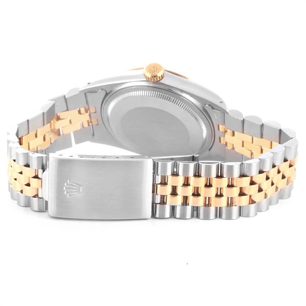 The image shows the back view of the Rolex Vintage Collection 16013 Men's Stainless Steel Champagne Dial 16013 Men's Stainless Steel Champagne Dial watch, focusing on its clasp, bracelet, and case back.