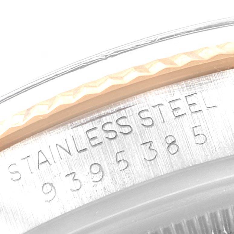 This close-up image shows the engraved stainless steel casing of a Rolex Vintage Collection 16013 Men's Stainless Steel Champagne Dial 16013 Men's Stainless Steel Champagne Dial watch.