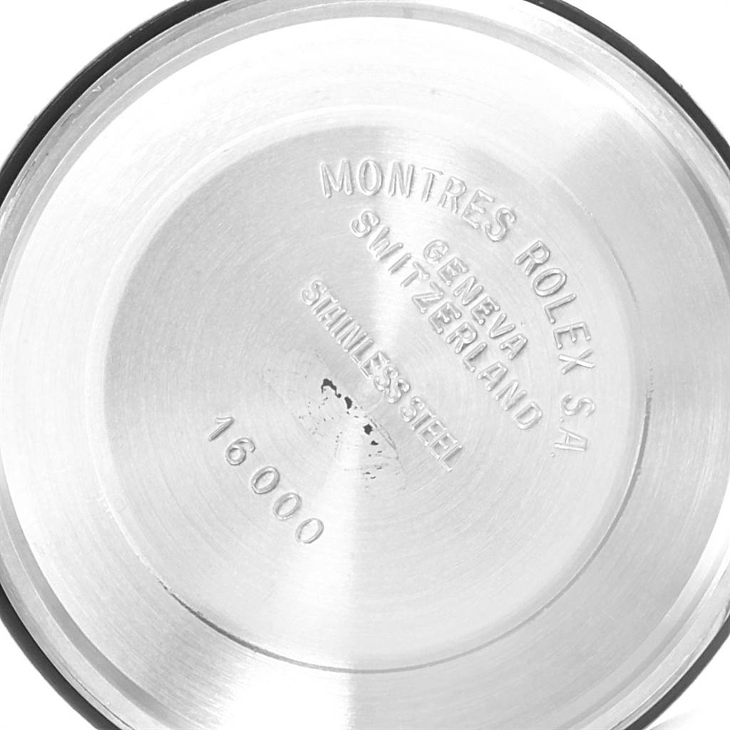 This image shows the interior case back of a Vintage Collection Rolex watch, highlighting the inscriptions and material markings.