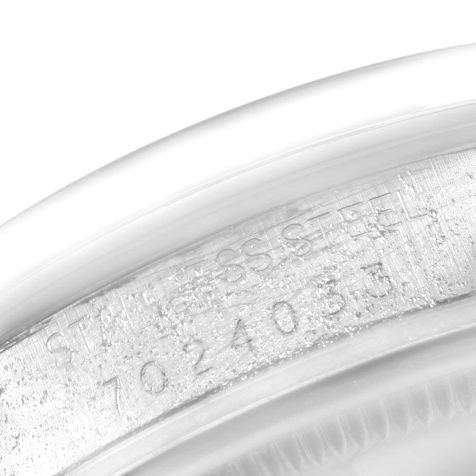 The image shows a close-up of the serial number engraving on the case of a Rolex Vintage Collection 15000 Men's Stainless Steel Silver Dial 15000 Men's Stainless Steel Silver Dial watch.