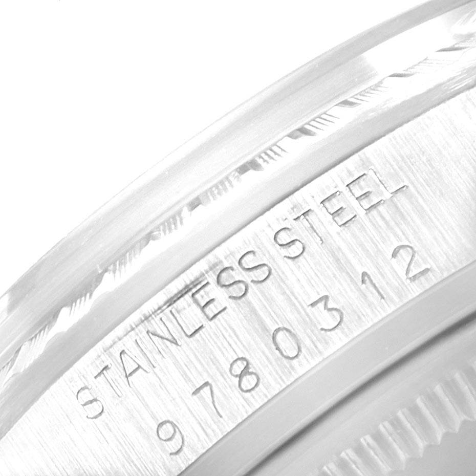This image shows a close-up of the stainless steel casing with engraved text on a Rolex Vintage Collection 16030 Men's Stainless Steel Silver Dial 16030 Men's Stainless Steel Silver Dial model.