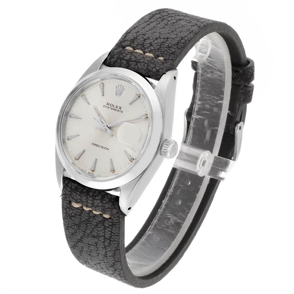 The image shows a Rolex Vintage Collection 6694 Men's Stainless Steel Silver Dial 6694 Men's Stainless Steel Silver Dial model watch from an angled side view, highlighting the dial, leather strap, and crown.
