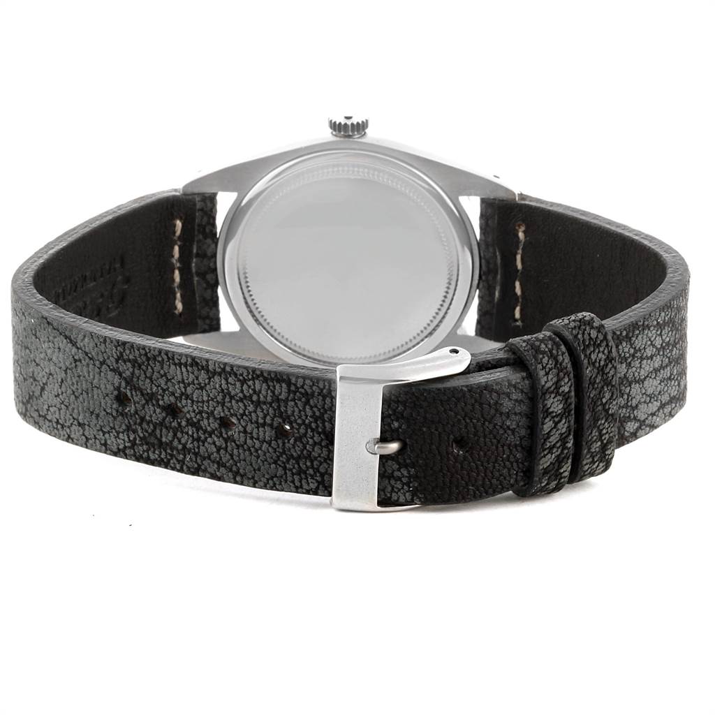 This image shows the back view of a Rolex Vintage Collection 6694 Men's Stainless Steel Silver Dial 6694 Men's Stainless Steel Silver Dial model watch, featuring the case back, crown, and leather strap with buckle.