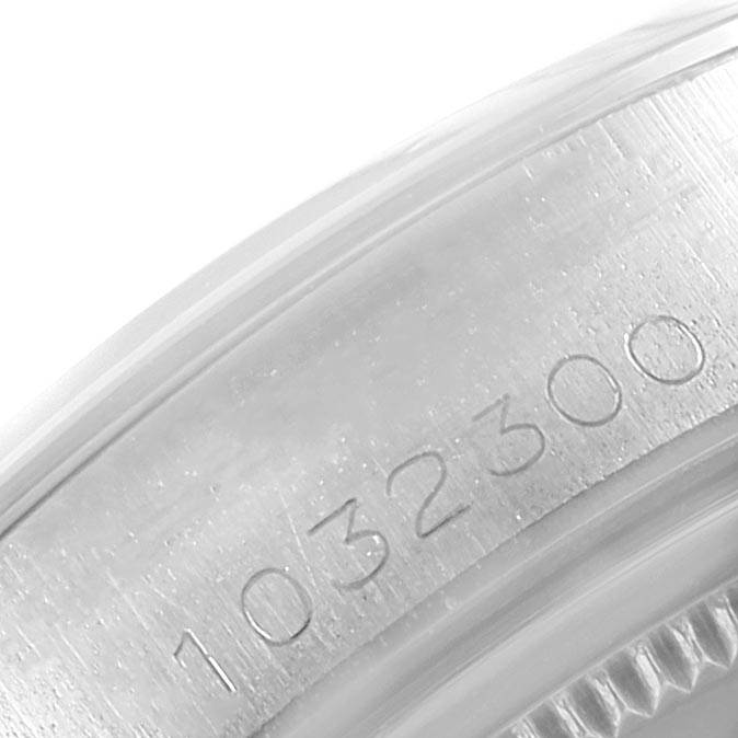 This close-up image of the Rolex Vintage Collection 6694 Men's Stainless Steel Silver Dial 6694 Men's Stainless Steel Silver Dial model shows the engraved serial number on the watch case.