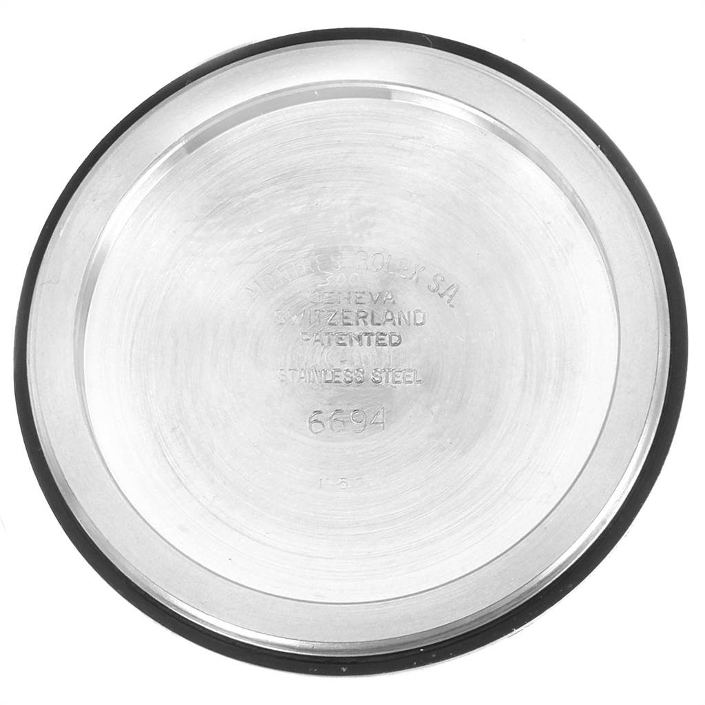 This image shows the inner case back of a Rolex Vintage Collection 6694 Men's Stainless Steel Silver Dial 6694 Men's Stainless Steel Silver Dial watch model 6694, with engravings indicating its specifications.