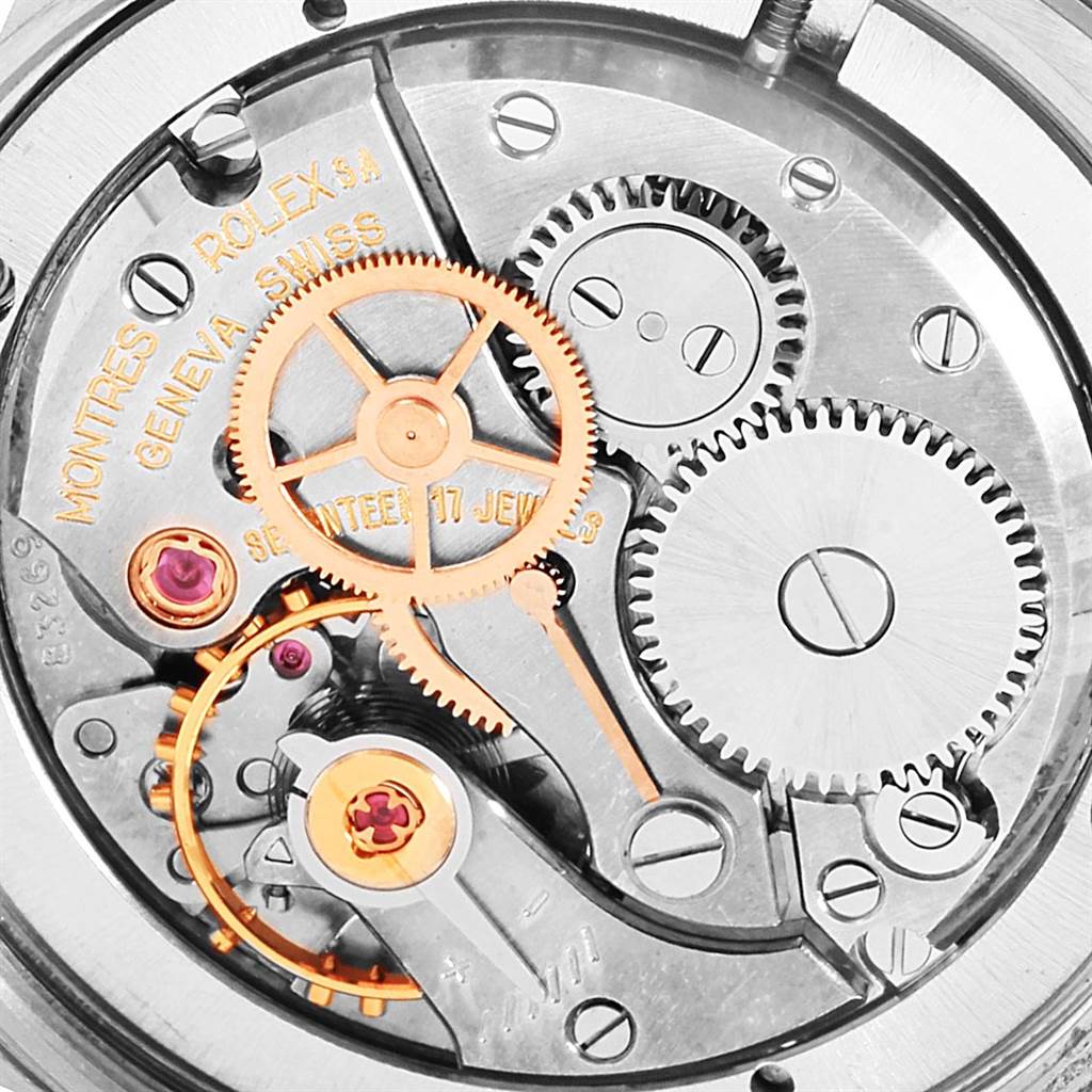The image shows a close-up view of the intricate inner mechanical components of a Vintage Collection Rolex watch.