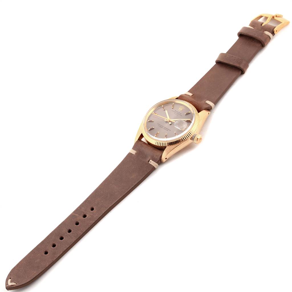 The image shows a Rolex Vintage Collection 1503 Men's Yellow Gold Brown Dial 1503 Men's Yellow Gold Brown Dial watch with a brown leather strap, gold case, and a side angle view of the dial and buckle.