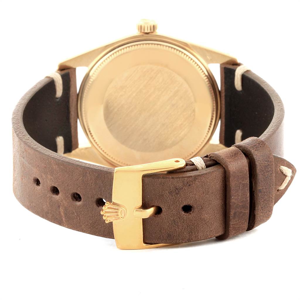 This image shows the back view of a Rolex Vintage Collection 1503 Men's Yellow Gold Brown Dial 1503 Men's Yellow Gold Brown Dial watch with a brown leather strap and gold-tone buckle.