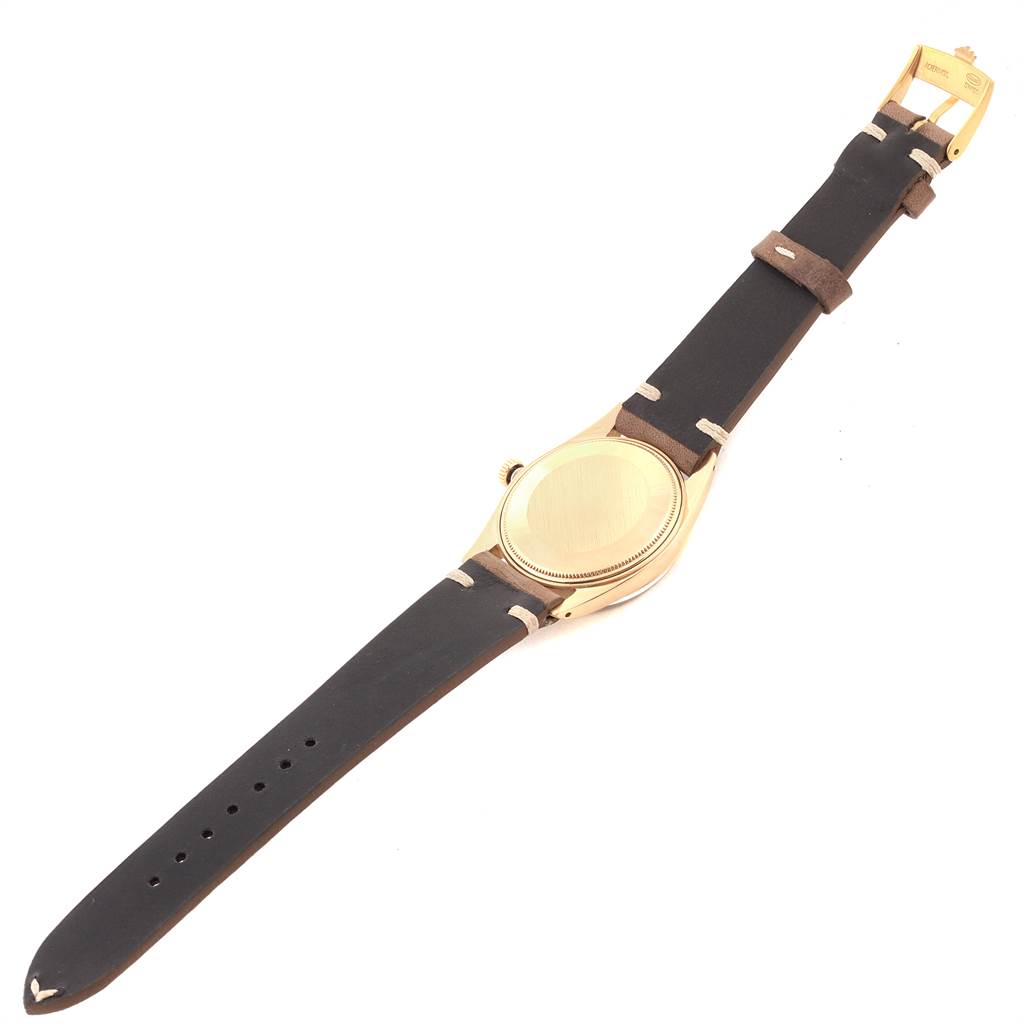 This image shows the back case and strap of the Rolex Vintage Collection 1503 Men's Yellow Gold Brown Dial 1503 Men's Yellow Gold Brown Dial watch.
