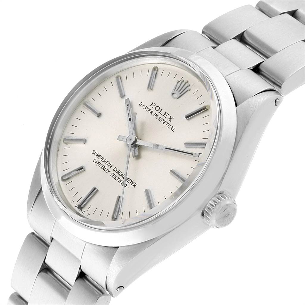 The Vintage Collection Rolex watch is shown at an upper-right angle, displaying the dial, crown, and bracelet.