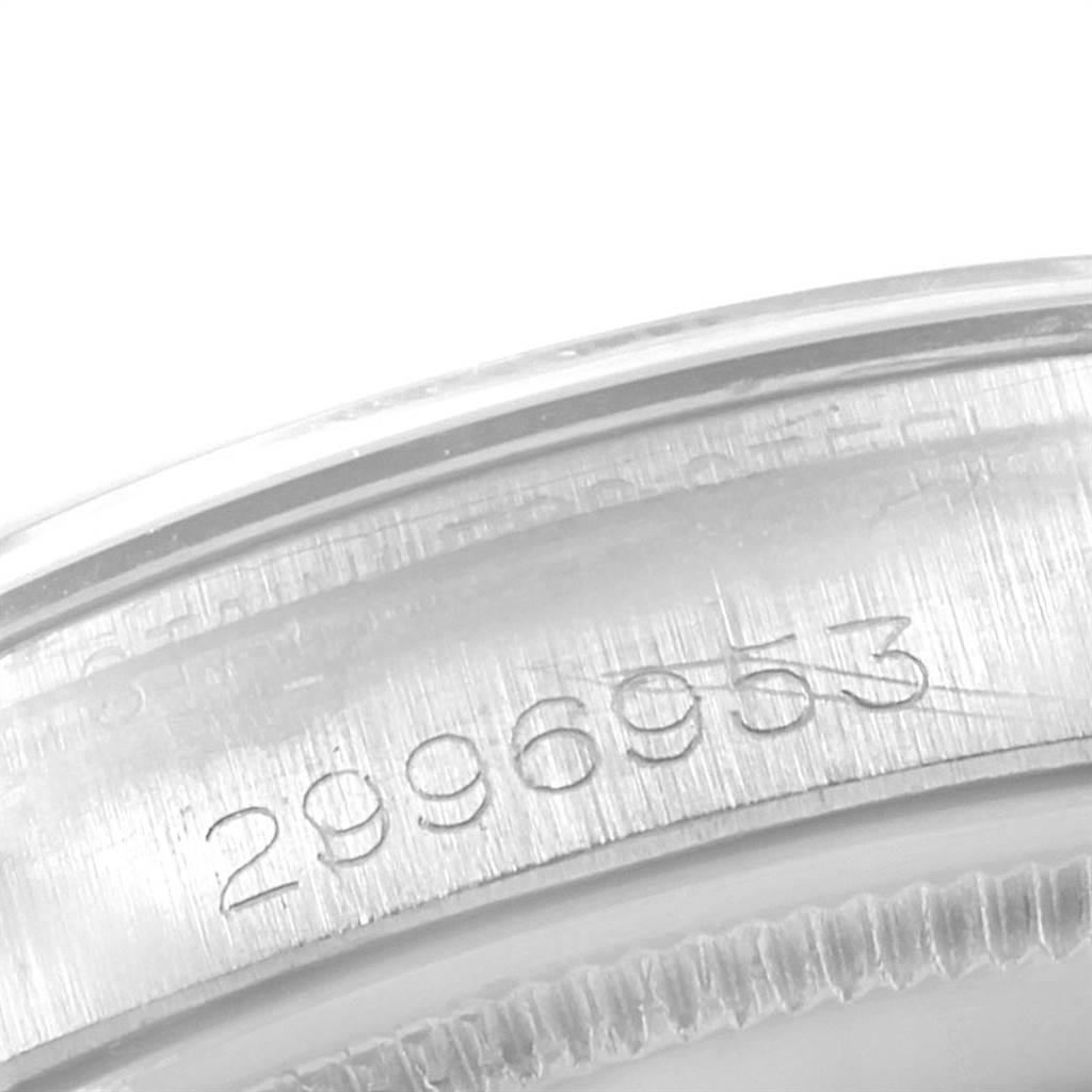 This close-up image shows the inner case back of the Rolex Vintage Collection 1002 Men's Stainless Steel Silver Dial 1002 Men's Stainless Steel Silver Dial watch with the serial number visible.
