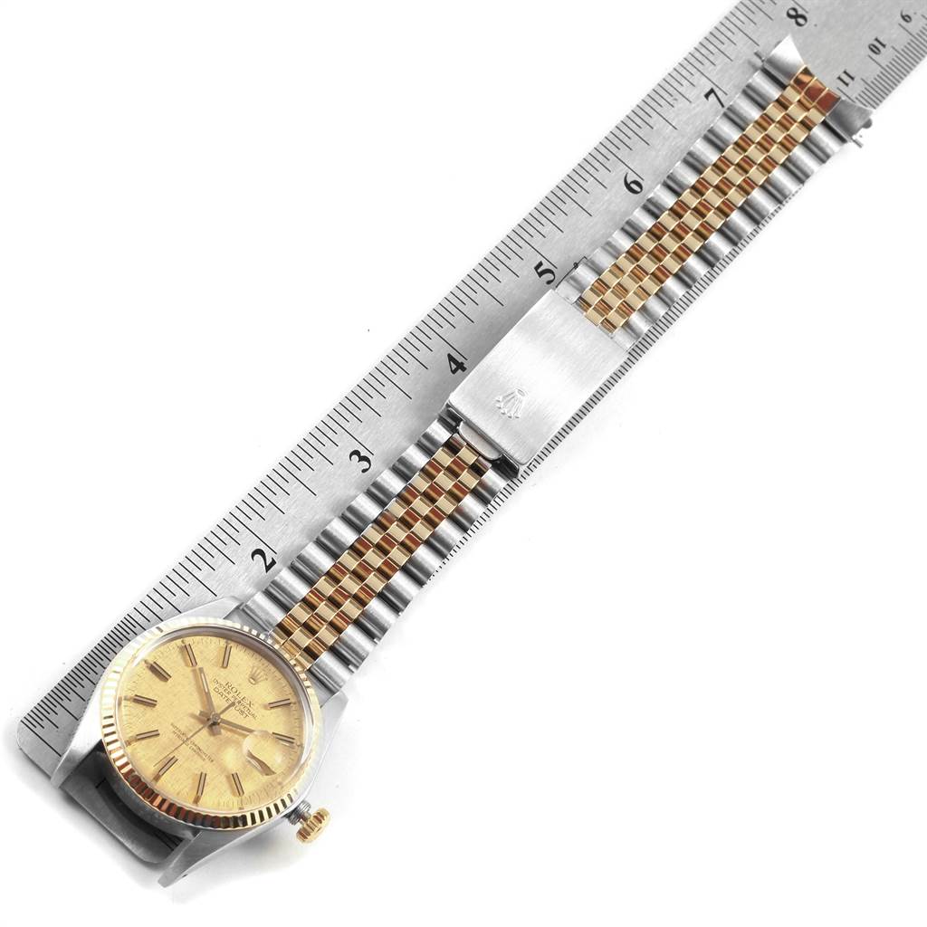 The image shows a Vintage Collection Rolex watch laid flat with its bracelet measured by a ruler, highlighting the face and clasp.