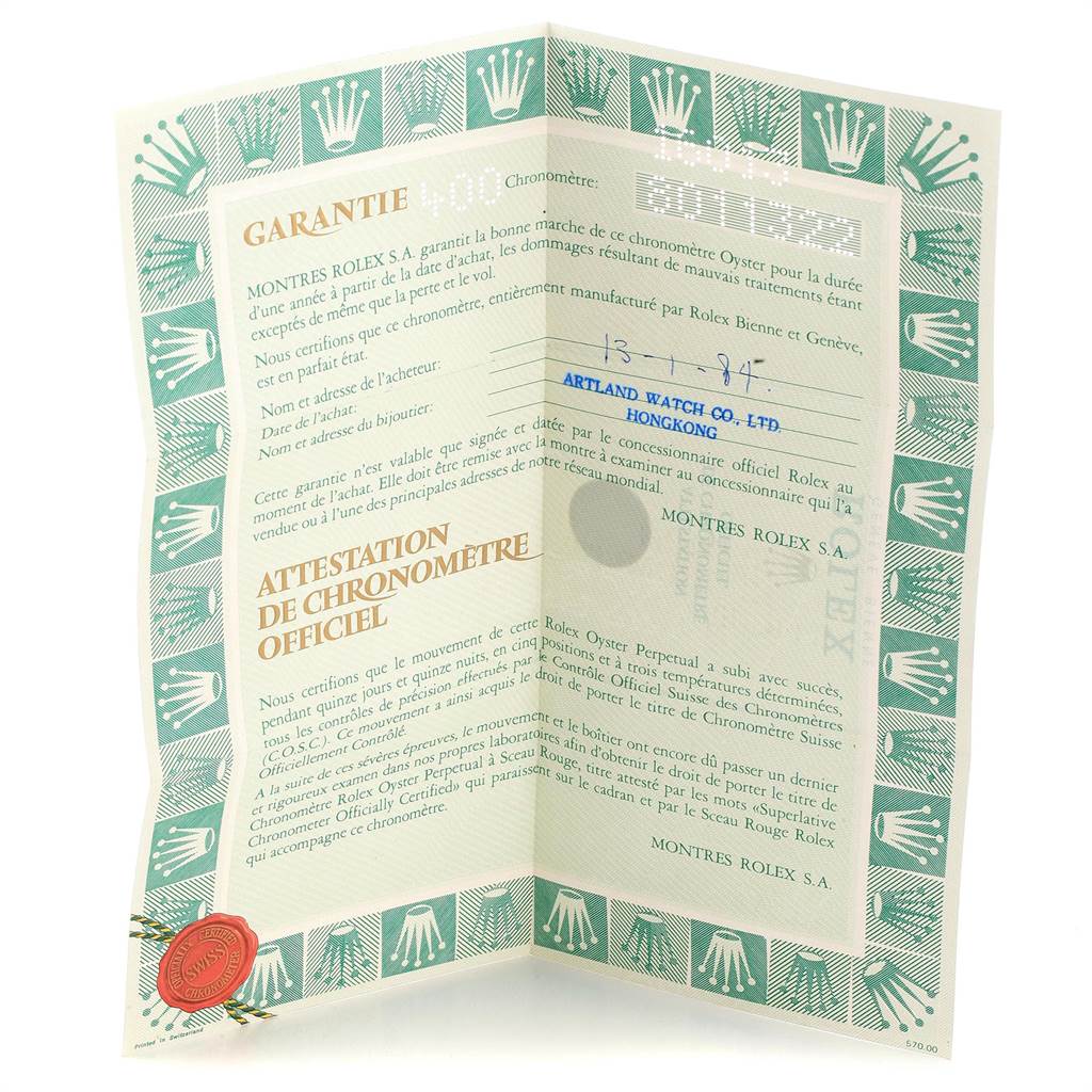 This image shows the Rolex warranty certificate for the Vintage Collection model, viewed at an angle revealing both pages.