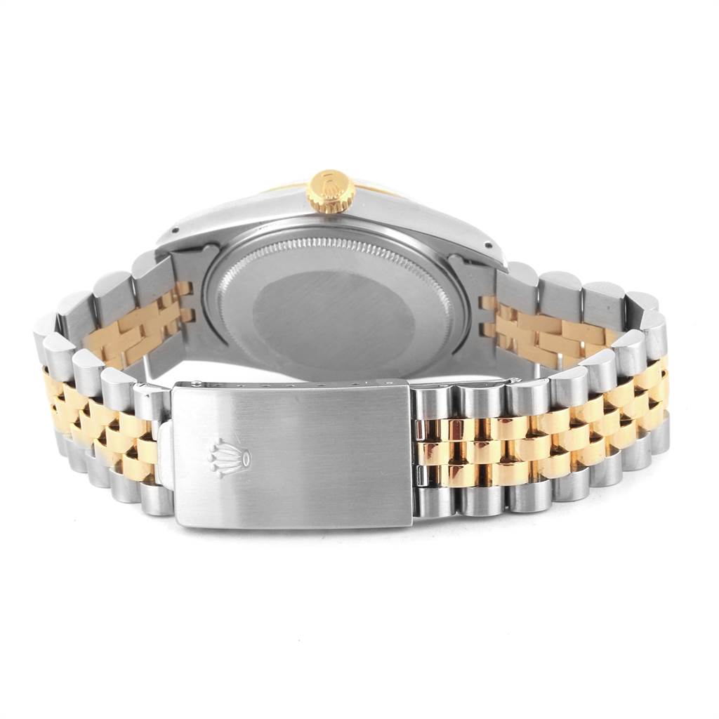 The image shows the back and clasp of a Rolex Vintage Collection 16013 Men's Stainless Steel Champagne Dial 16013 Men's Stainless Steel Champagne Dial watch, featuring a two-tone bracelet and crown.
