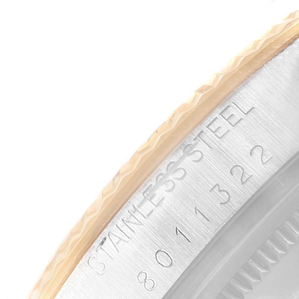 This close-up image shows the edge of the stainless steel case back and fluted bezel of a Rolex Vintage Collection 16013 Men's Stainless Steel Champagne Dial 16013 Men's Stainless Steel Champagne Dial watch.