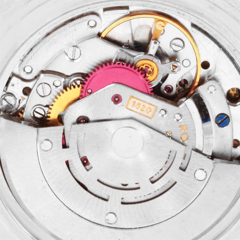 This image shows a close-up view of the intricate mechanical movement inside a Vintage Collection model by Rolex.
