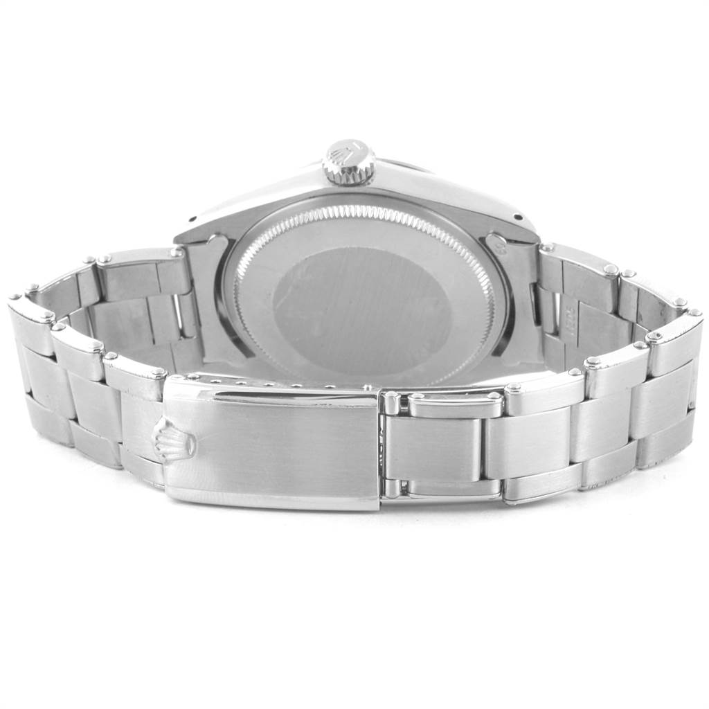 The image shows the back view of the Rolex Vintage Collection 1500 Men's Stainless Steel Silver Dial 1500 Men's Stainless Steel Silver Dial watch, highlighting the case back and metal bracelet.